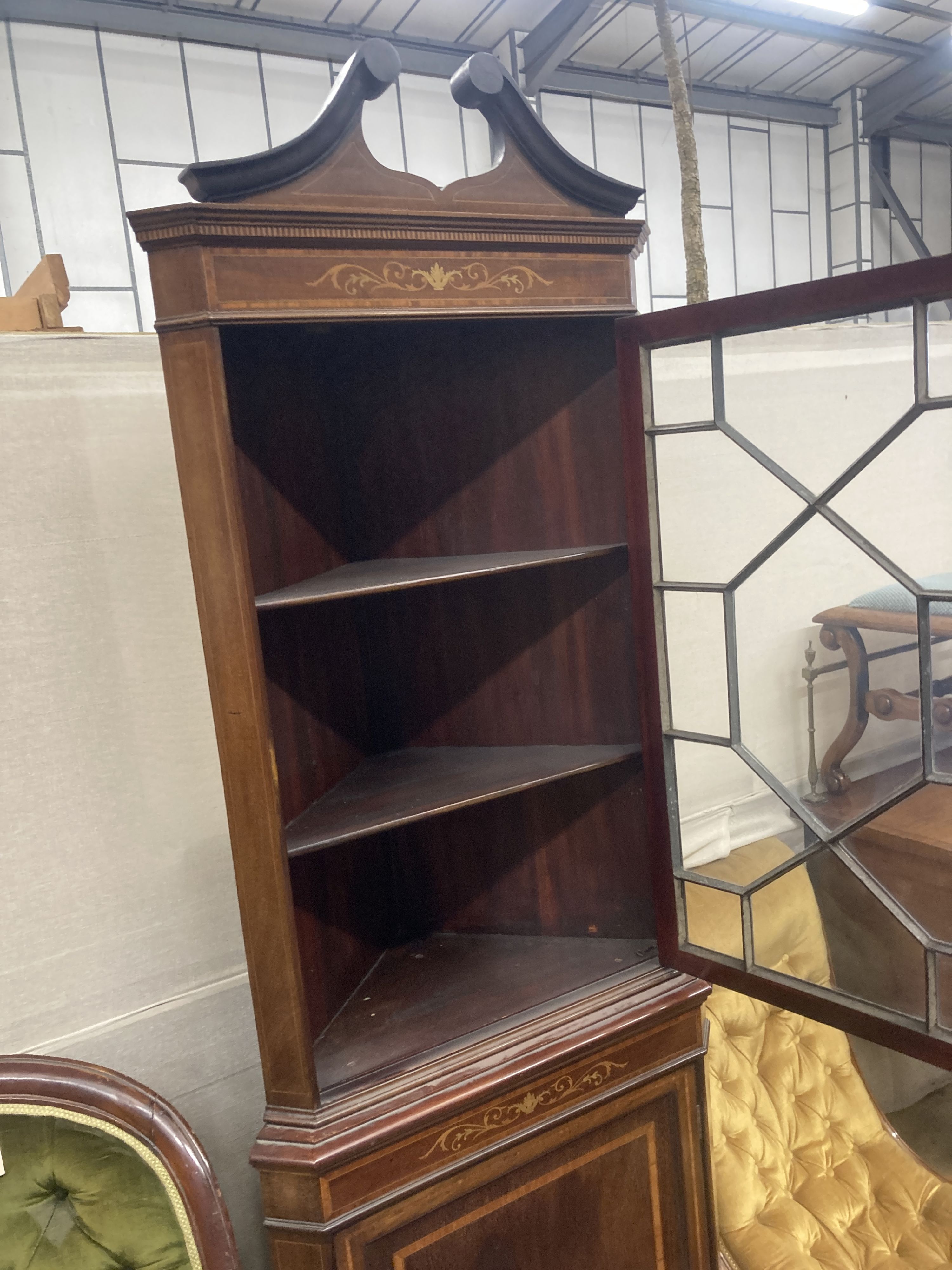 An Edwardian marquetry inlaid and cross banded mahogany standing corner cabinet, width 70cm, depth 40cm, height 205cm